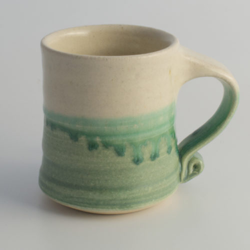 green & white ceramic mug