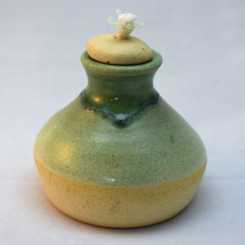stoneware oil lamp with green glaze